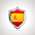 Spain flag projected as a glossy shield on a white background