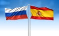 Spain Flag with Russia Flag with cloudy sky Royalty Free Stock Photo