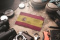 Spain Flag Between Traveler`s Accessories on Old Vintage Map. Tourist Destination Concept Royalty Free Stock Photo