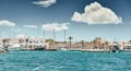 Spain, Formentera, 29 April 2018: The harbor of famous Formentera, a lighthouse, azure water, boats, sunny weather