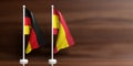 Spain and Germany flags on wooden background. 3d illustration