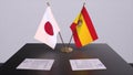 Spain and Japan national flags, political deal, diplomatic meeting. Politics and business 3D illustration