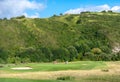 Spain, June 2021: People playing golf near the mountains and the beach in Zarautz, golf club, Real Golf Club De Zarauz, Basque Royalty Free Stock Photo