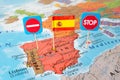 Spain lockdown concept image stop country flag and stop signs on map, travel restrictions border shutdown