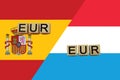 Spain and Luxembourg currencies codes on national flags background
