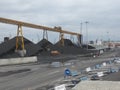 Spain: mountains of charcoal at Tarragona\'s harbour