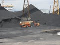 Spain: mountains of charcoal at Tarragona\'s harbour