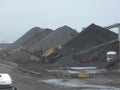 Spain: mountains of charcoal at Tarragona\'s harbour