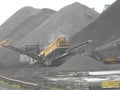 Spain: mountains of charcoal at Tarragona\'s harbour