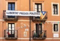 Spain; Oct 20: Catalan flag and banner with political message on the balconies of a traditional house. Freedom for political