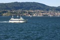 View of river with ferry villages and mountains