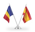 Spain and Romania table flags isolated on white 3D rendering