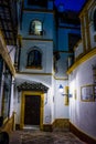 Spain, Seville, EMPTY ALLEY AMIDST BUILDINGS IN CITY AT NIGHT