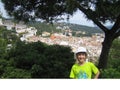 Spain. Smiling girl on the background of the panorama of the resort town.