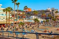 Spain, Tenerife, Adeje - December 17, 2018: Beach straw umbrellas at sunset landscape. Seaside resort. Tourism and travel.