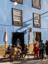 Street view with beautiful ancient houses and people sitting on the cafe