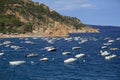 Spain Tossa de Mar, Bay of Sunny day pleasure boat waves rocks