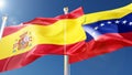 spain and venezuela flags waving in the wind against a blue sky. spanish, venezuelan national symbols 3d rendering