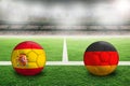 Spain versus Germany flags on football in Soccer Stadium With Copy Space