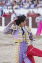 Spainish bullfighter Sebastian Castella taking the cap from him