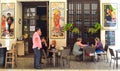 Spanish tapas Bar with colourful ceramic tiles on walls, customers enjoying lunch.