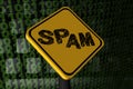 Spam warning sign on binary code