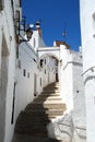 Steep steps up a narrow old town street, Arcos de la Frontera, Spain.