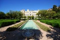 Fountain in the Pedro Luis Alonso gardens with the city hall to the rear, Malaga, Spain. Royalty Free Stock Photo