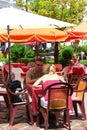 Couple at a pavement cafe, Marbella, Spain.