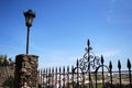 Ornate ironwork fence with views over part of the town and countryside, Ronda, Spain.