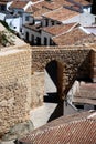 Part of the old town wall and stone arched gateway, Antequera, Spain.