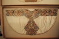 Elaborate Matador cape mounted on the wall in the bullfighting museum, Ronda, Spain.