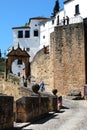 View along the old bridge towards the Philip V arch, Ronda, Spain. Royalty Free Stock Photo