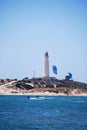 Kitesurfers and lighthouse at Cape Trafalgar, Spain.