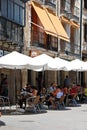 Tourists relaxing at a pavement cafe in the town centre, Ubeda, Spain.