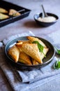 Spanakopita triangles stuffed with spinach and Feta cheese