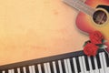 Spanish acoustic folk guitar and piano keyboard with beautiful t Royalty Free Stock Photo