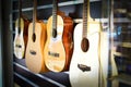 Spanish acoustic guitars hanging on the wall at a music store Royalty Free Stock Photo