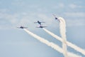 Spanish Air Force Eagle Patrol performing aerobatics at air show