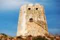 Spanish ancient tower in the coast with vivid blue sky back Royalty Free Stock Photo