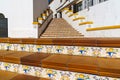 Spanish architecture style buildings with whitewashed walls and beautiful colorful tiled stairs Royalty Free Stock Photo