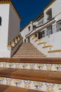 Spanish architecture style buildings with whitewashed walls and beautiful colorful tiled stairs Royalty Free Stock Photo