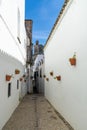 Spanish architecture style buildings with whitewashed walls and flower pots on the walls Royalty Free Stock Photo