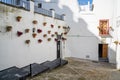 Spanish architecture style buildings with whitewashed walls and flower pots Royalty Free Stock Photo
