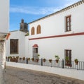 Spanish architecture style buildings with whitewashed walls and flower pots Royalty Free Stock Photo