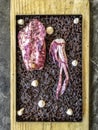 Spanish Black Rice (Arroz Negro a la Llauna) with squid, cooked on a Llauna