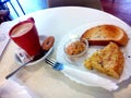 Spanish breakfast. Coffe with milk, bread with tomatoe and spanish omelette.