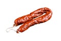 Spanish chorizo pork cured sausage. Isolated on white background, top view.