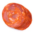 Spanish chorizo salami sausage slices, with pork meat and paprika, isolated on white Royalty Free Stock Photo