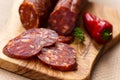 Spanish chorizo sausage with parsley on rustic boa Royalty Free Stock Photo